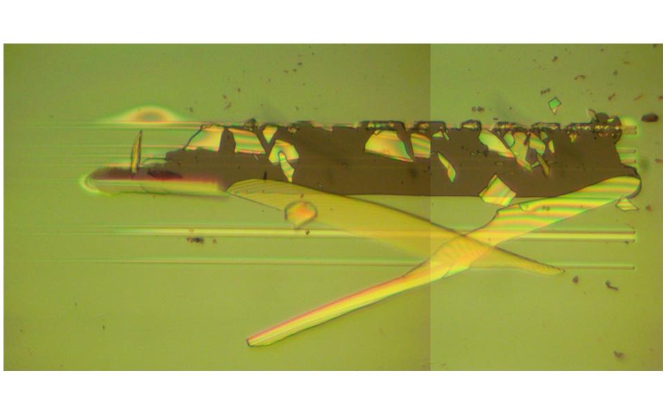 image showing failure of optical coating using randomised nano-scratch test technique developed by Micro Materials Ltd